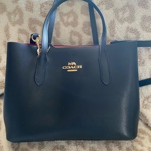 Black medium sized coach bag.